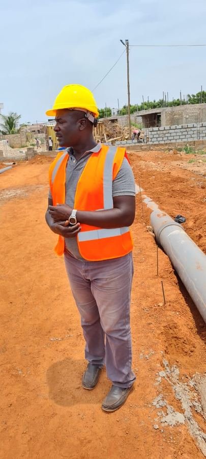 Worker on site with drainage pipe